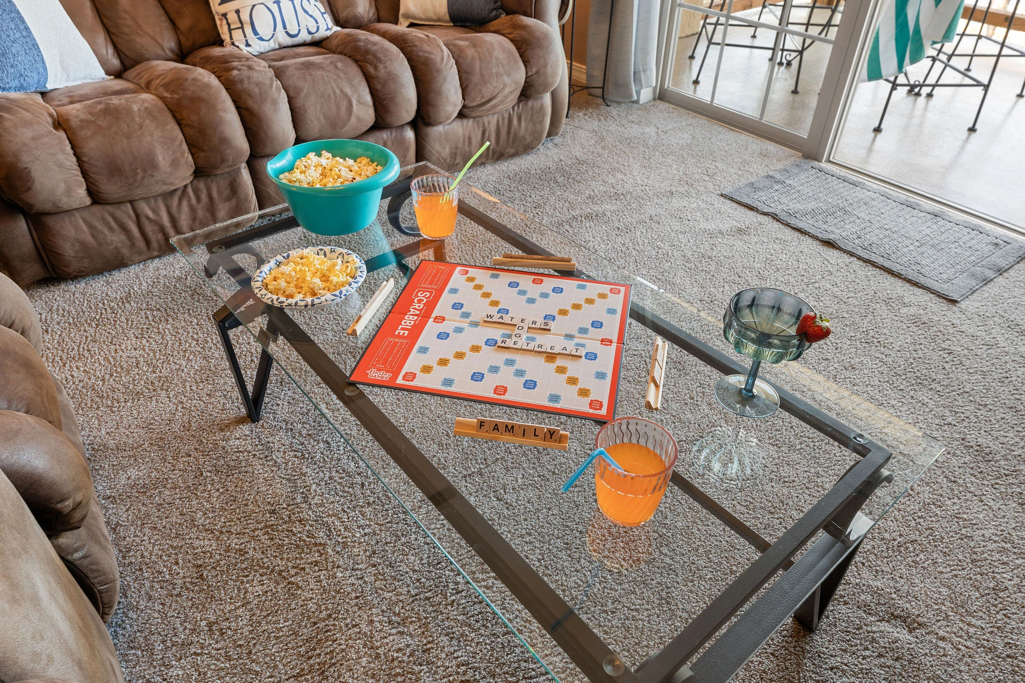 Family game time with the sound of boats going by and waves lapping at the shore