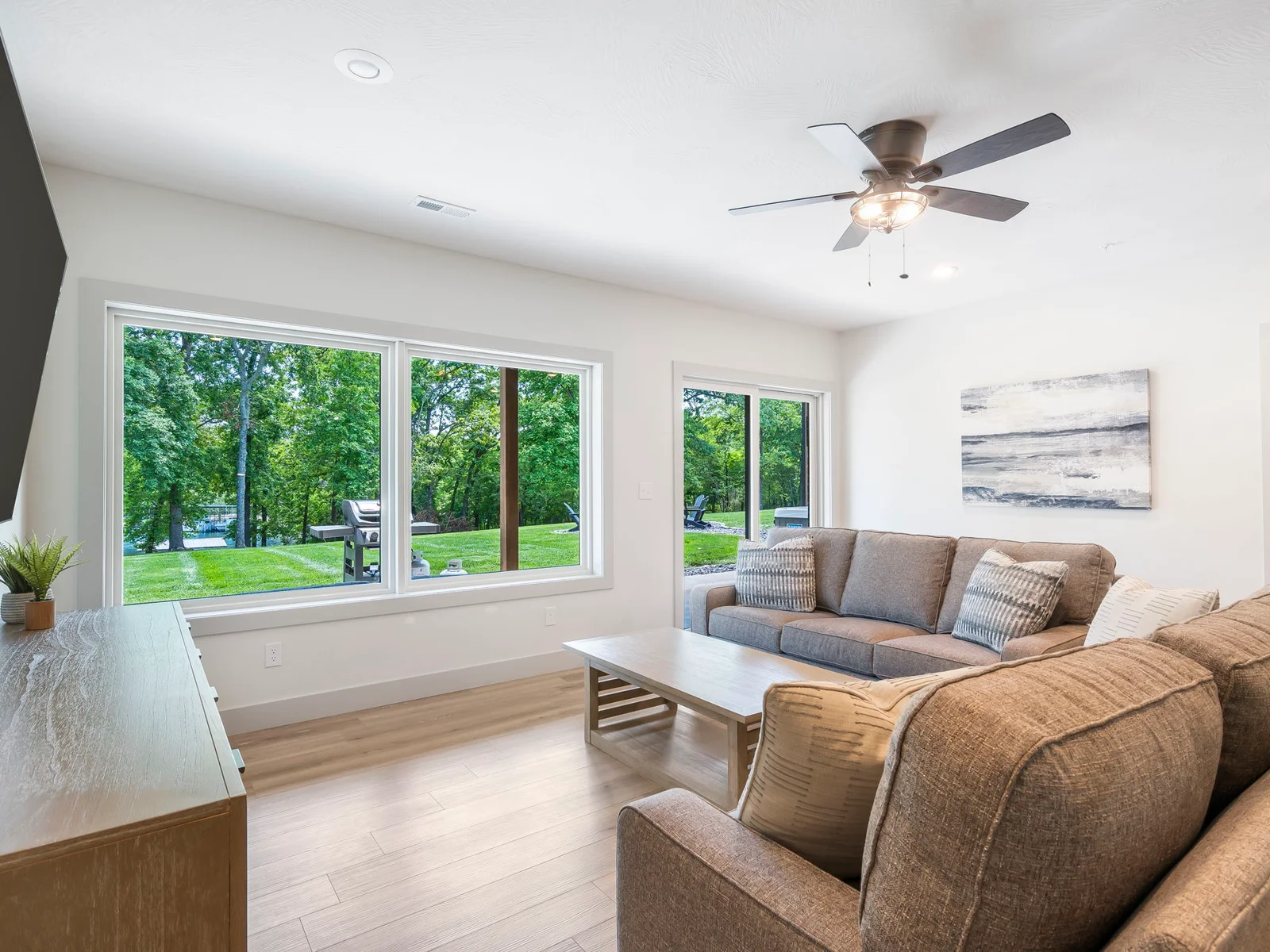 Walkout to the expansive yard, grill, firepits, and private hot tub
