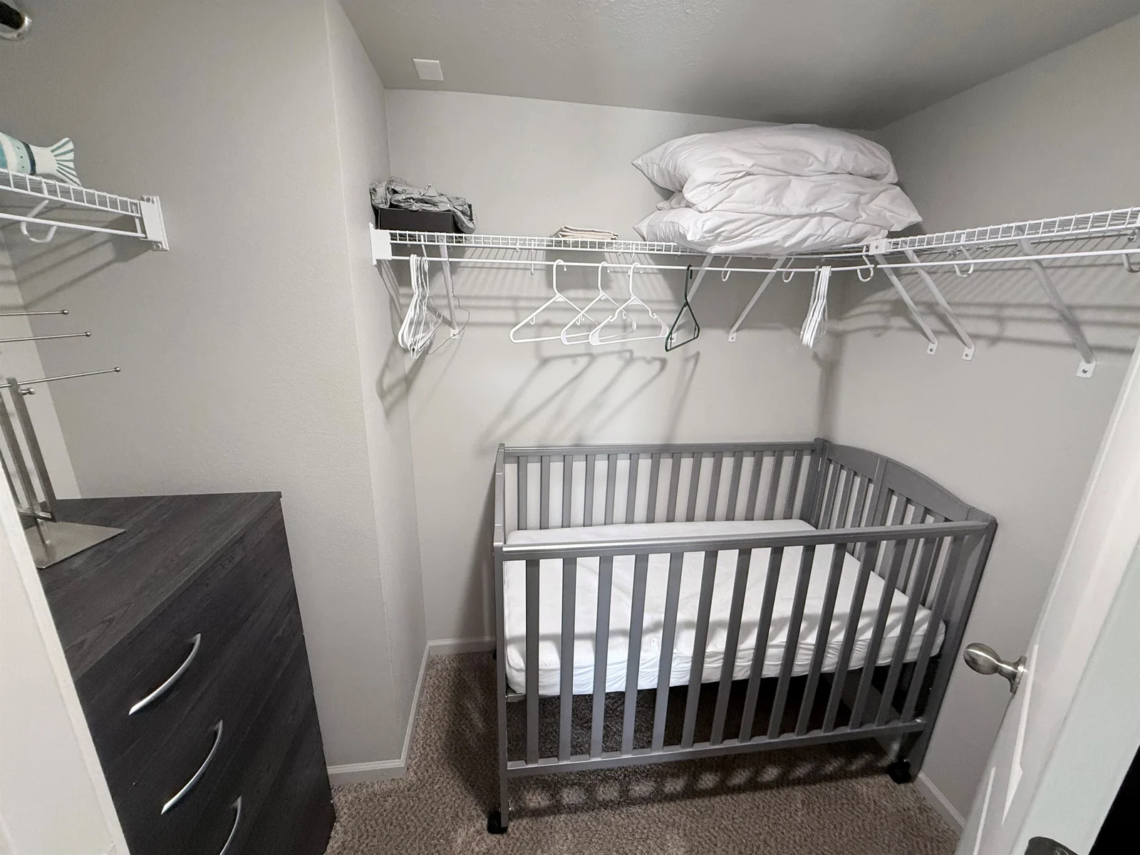 crib is stored in closet. can be rolled into bedroom