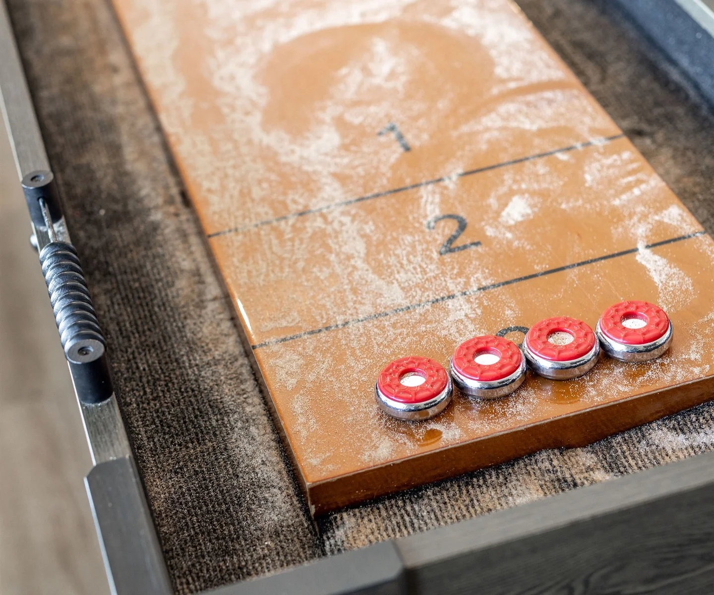 Challenge your friends to a shuffleboard game!