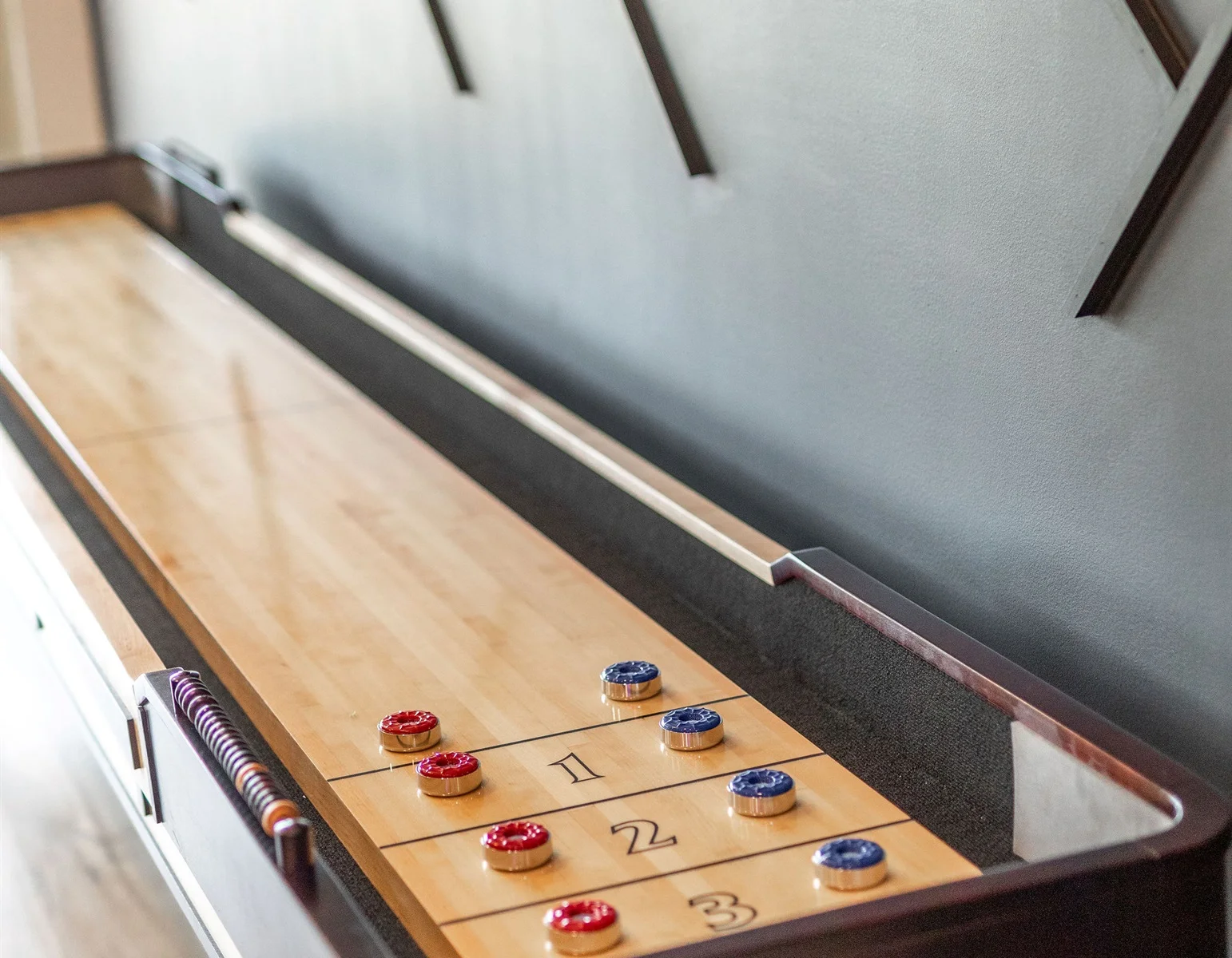Compete with the family in shuffleboard!
