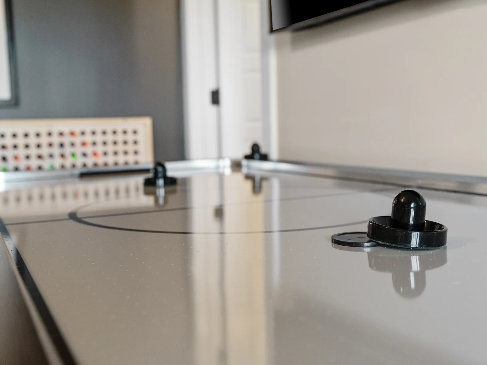Game Room: Challenge friends to epic air hockey battles in your stylish retreat!