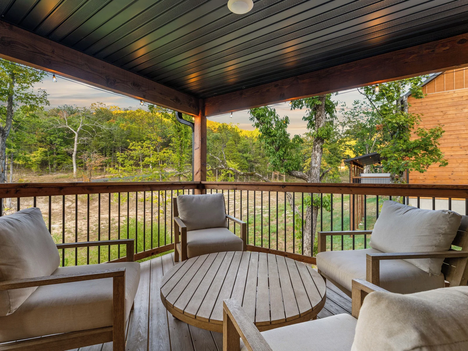 Seating area with 4 chairs and coffee table. Great private outdoor view.