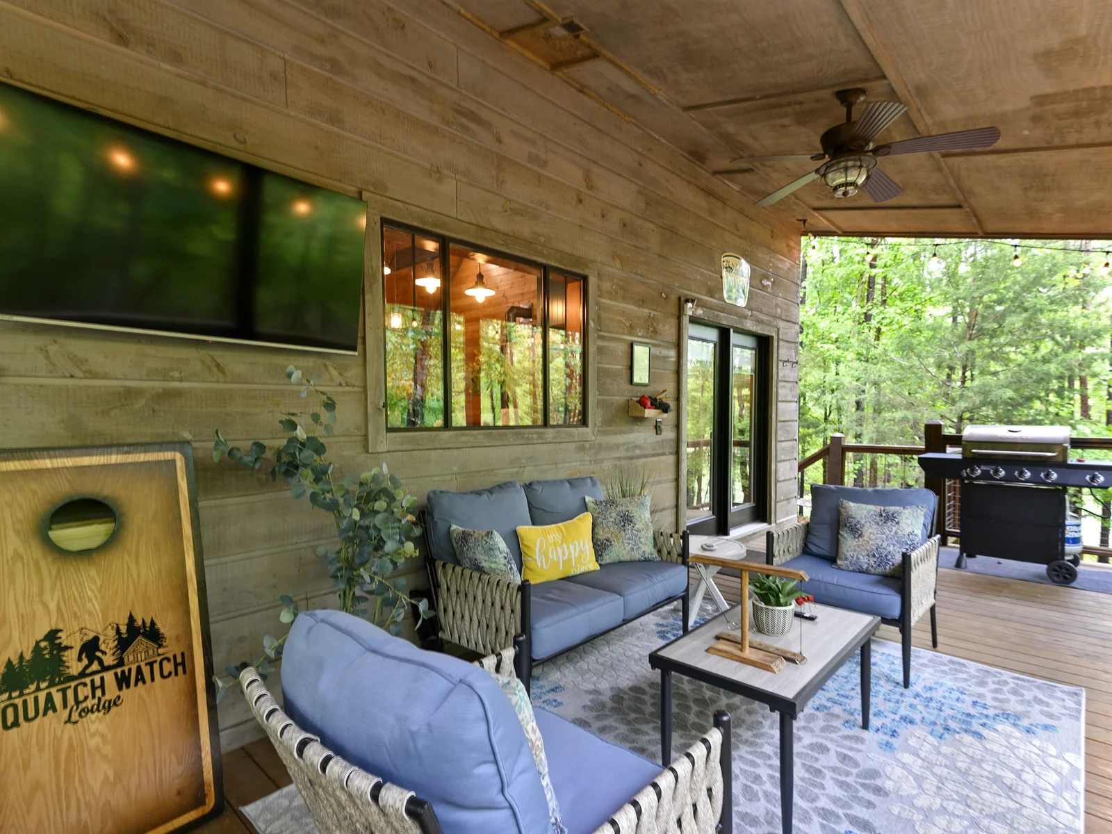The ultimate hangout spot: back deck fun with games and a big-screen experience under the sky