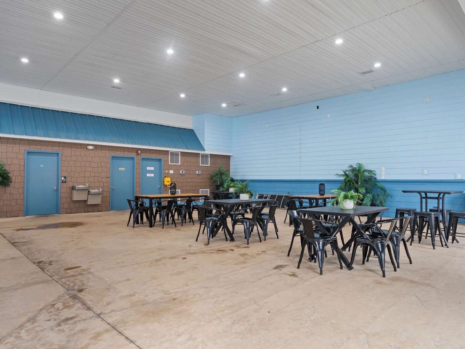 Indoor pool. Heated, and fun kid friendly features. Bathrooms, lounge chairs, and dining tables. Open year round.