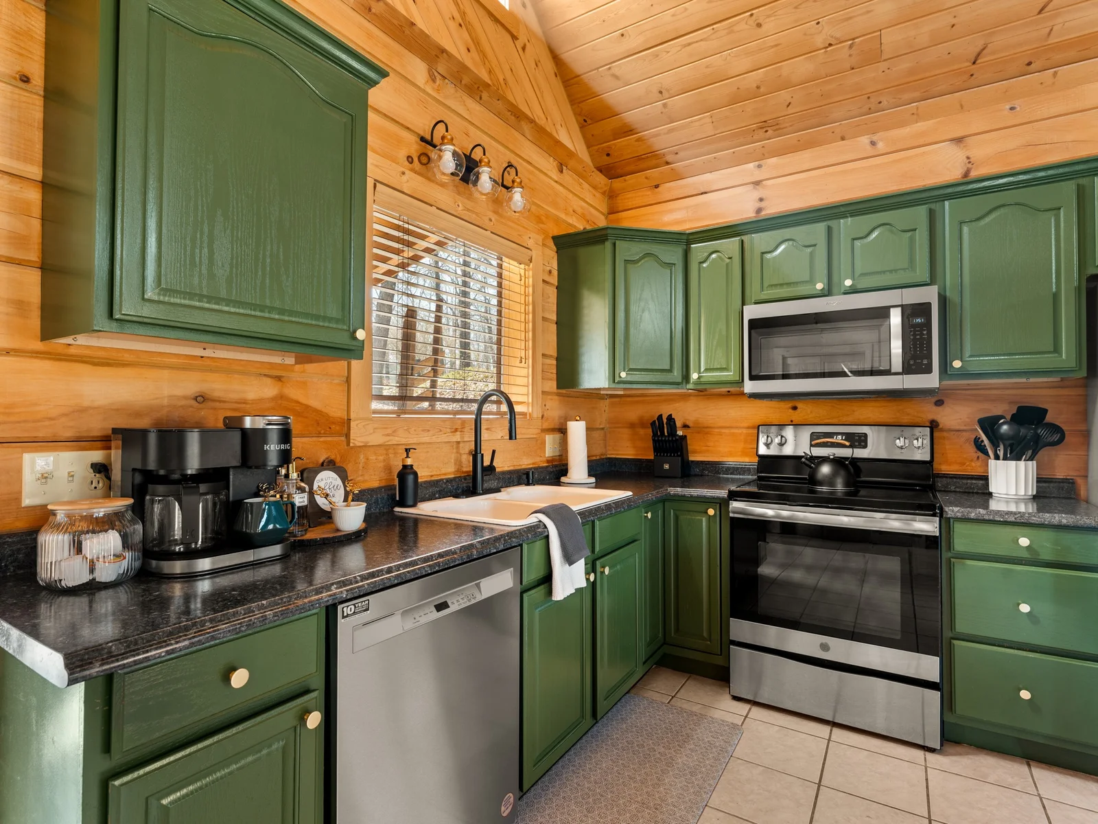 Kitchen with Keurig, dishwasher, stove and microwave. Everything you need for pancakes in the morning and a big dinner at night.