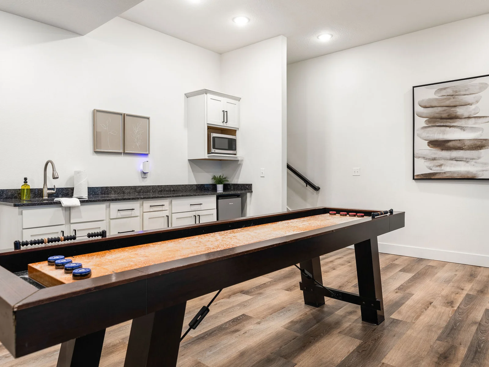 shuffleboard next to the mini fridge and microwave downstairs!