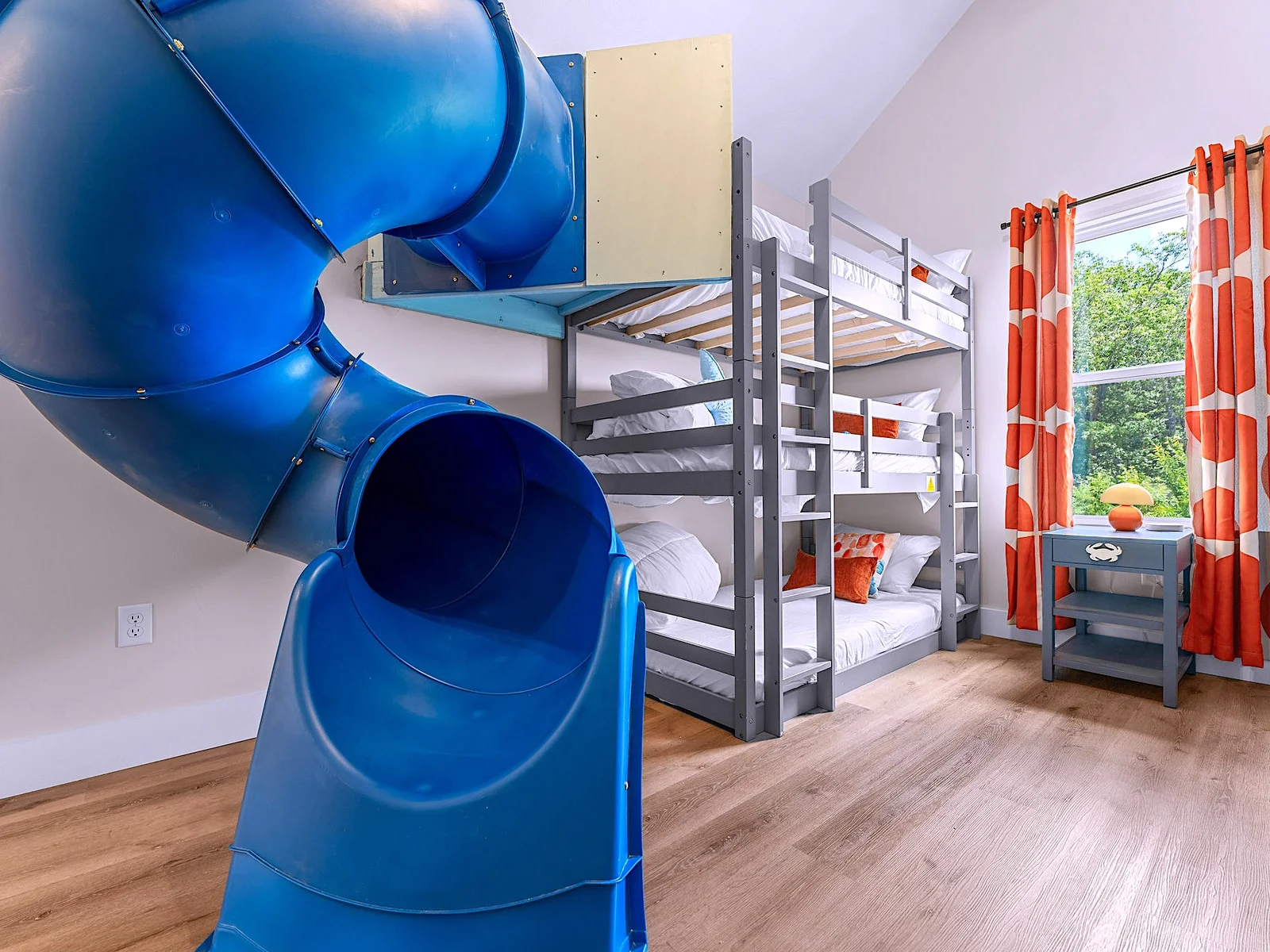 Let the fun begin! This bunk room features 6 beds, a slide, and a climbing wall for nonstop excitement.