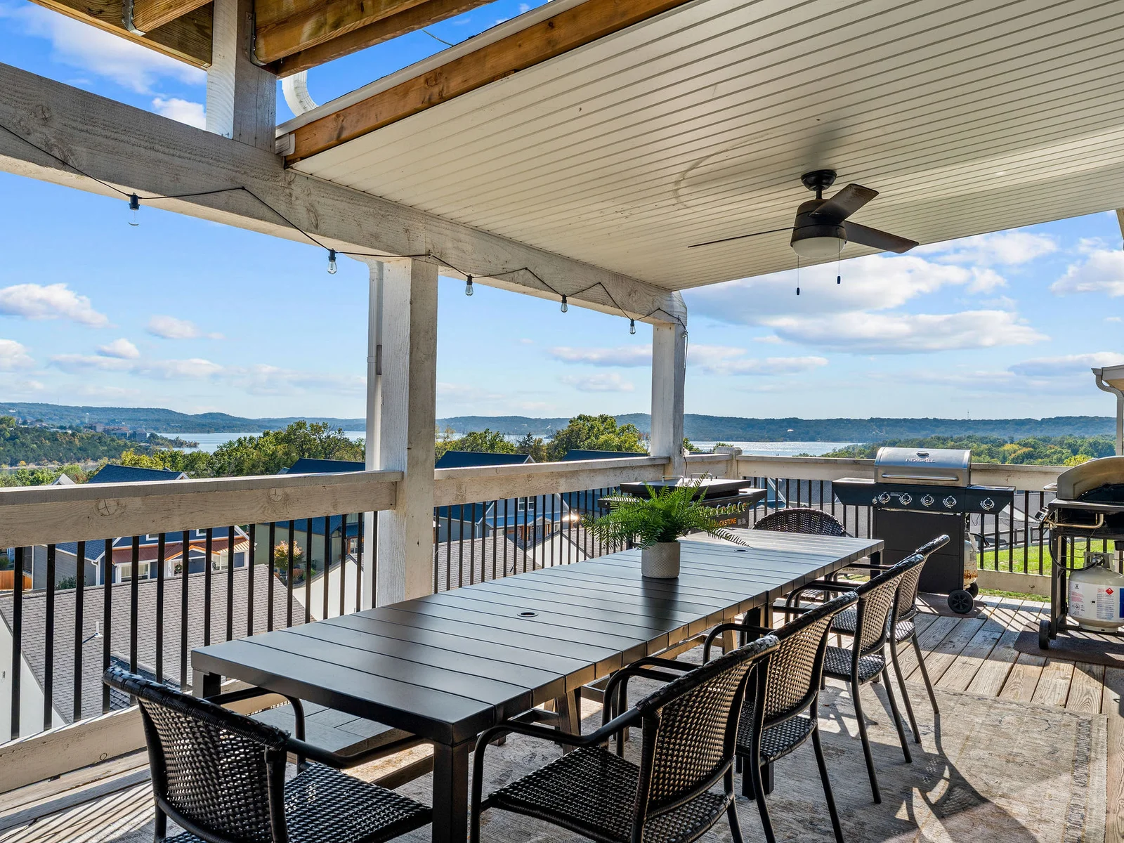 2 Grills and a blackstone next to the outdoor dining table!