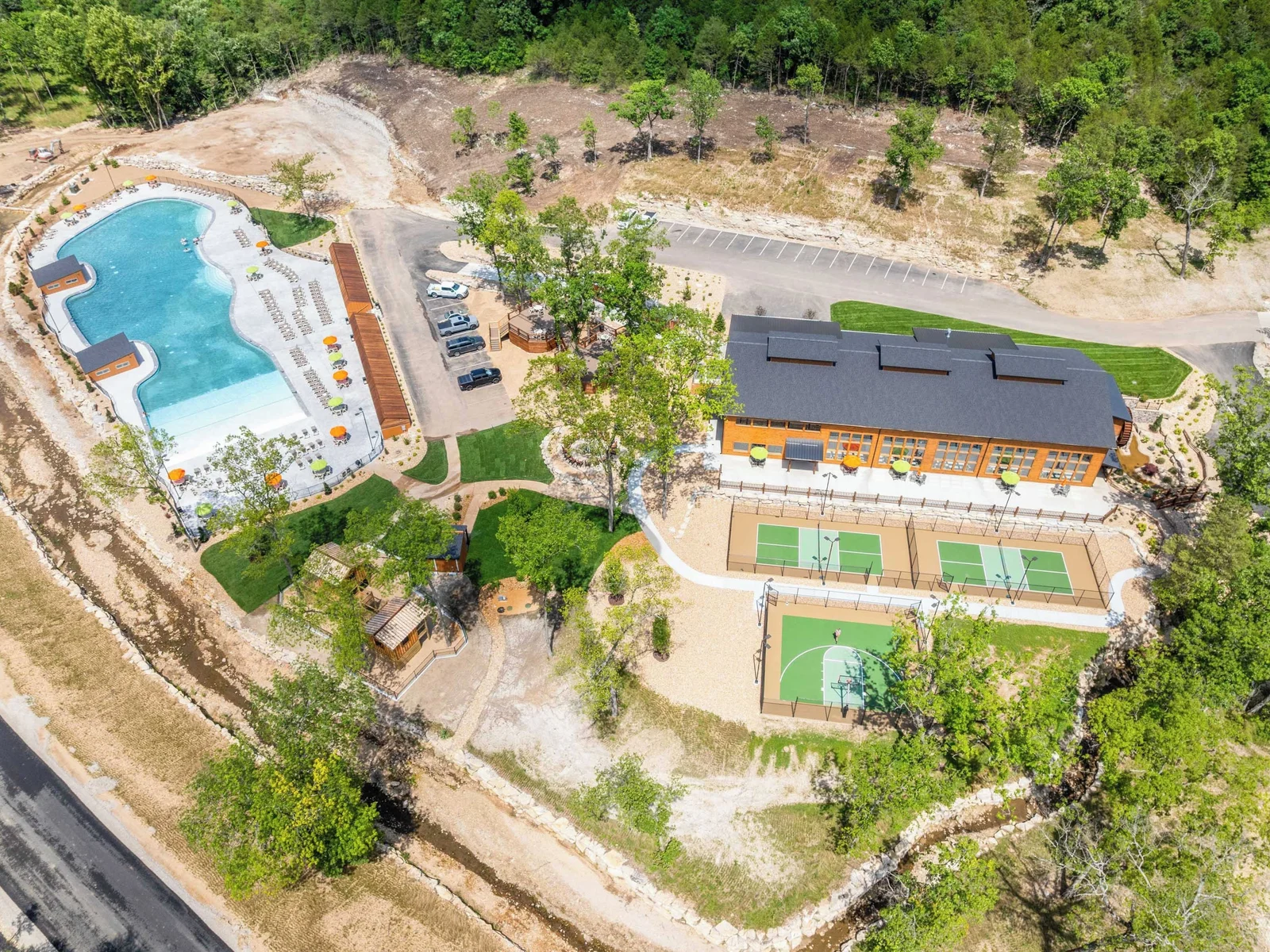 Aerial view of outdoor/indoor pools and sports courts walking distance from the cabin.