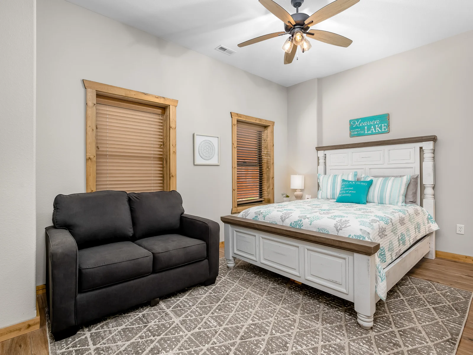 Queen bedroom with twin sleeper sofa and attached bath