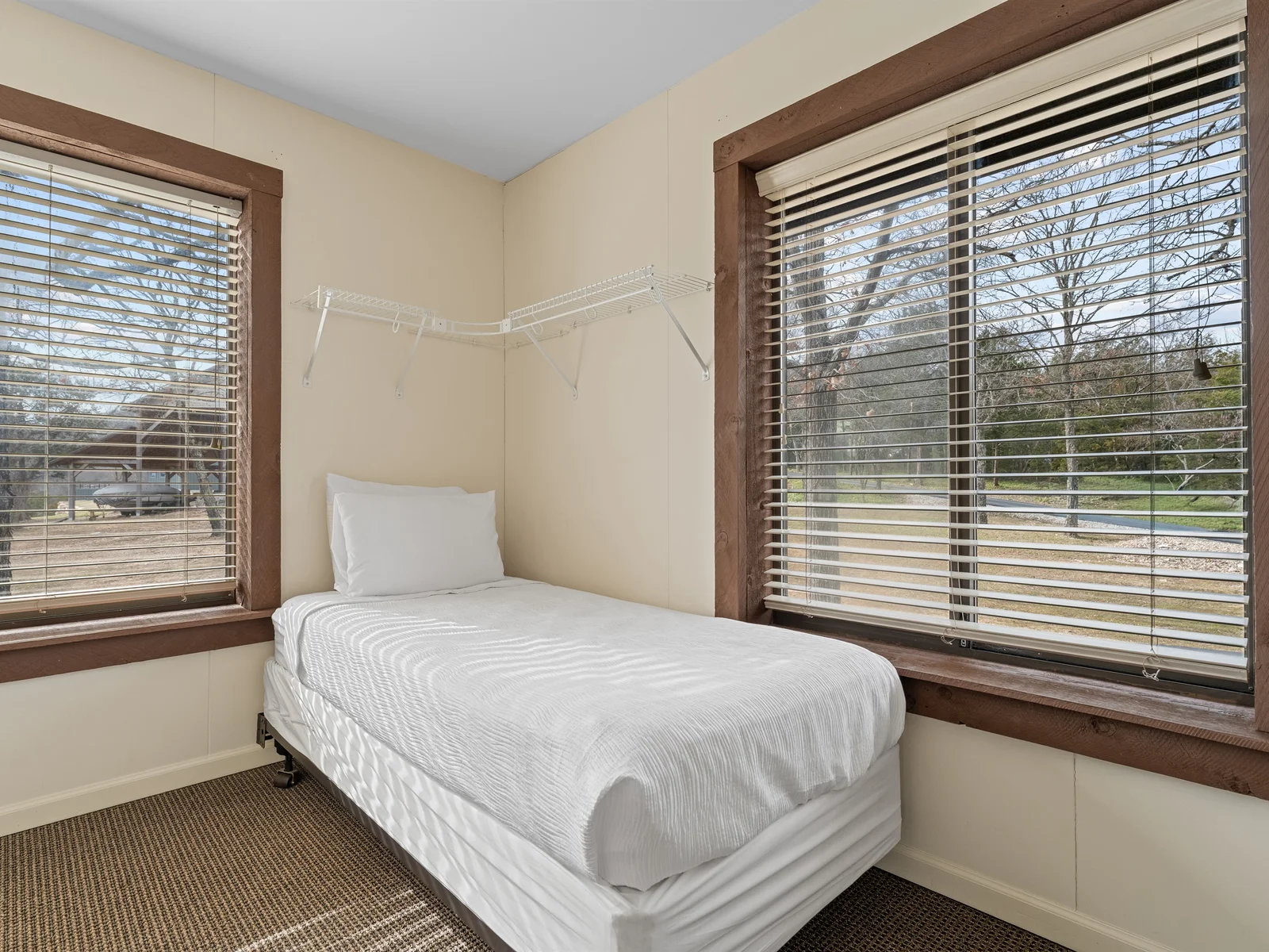A cozy sleeping space ideal for kids or extra guests, thoughtfully arranged for comfort.