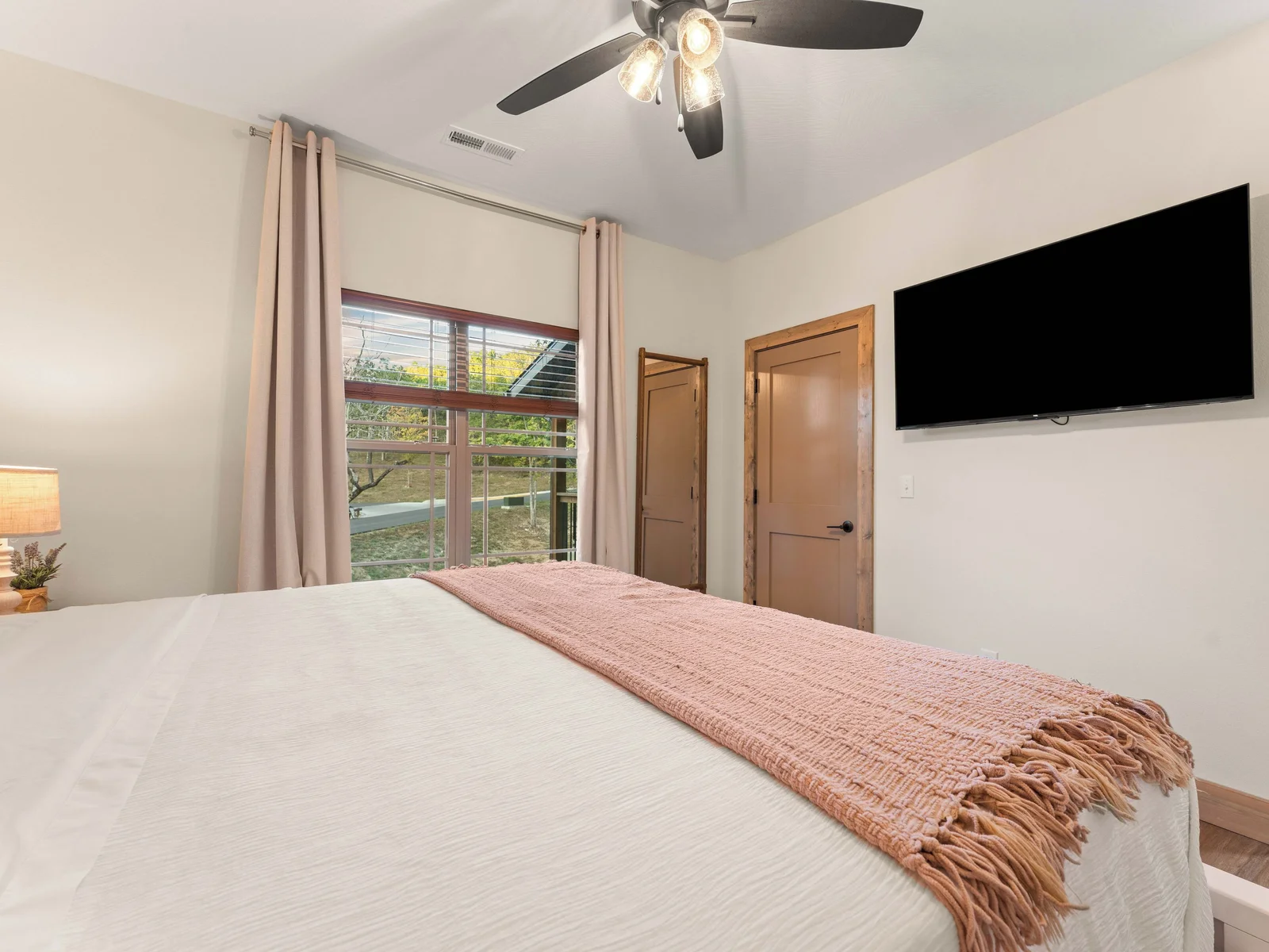 Bedroom 2 Downstairs on the right, King Bed, bathroom ensuite. Great view to nature from every room.