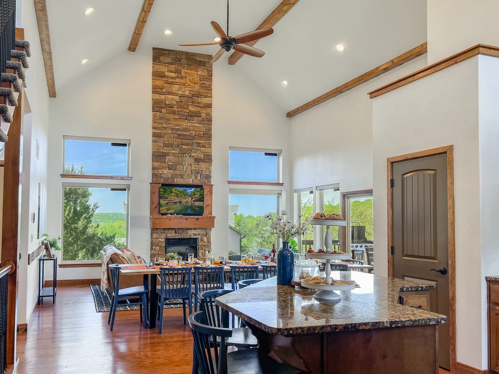 Upon entering Deep Forest Retreat you will be greeted with a beautiful open concept room with a large dining table and fireplace.