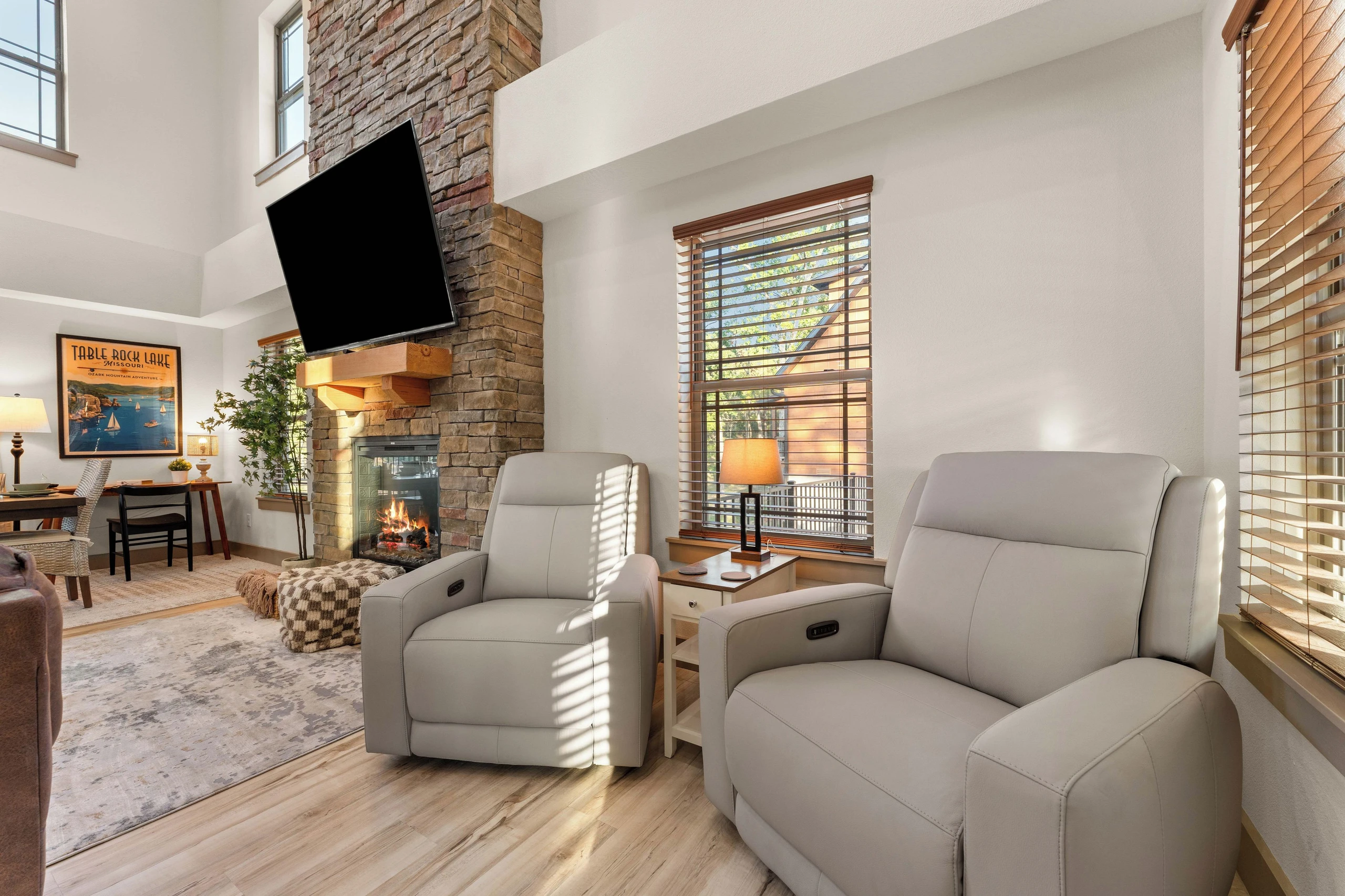 Two electric leather reclining chairs near windows for a lot of natural light. Oversized tv, don't forget your passwords for streaming from your accounts while on vacation.