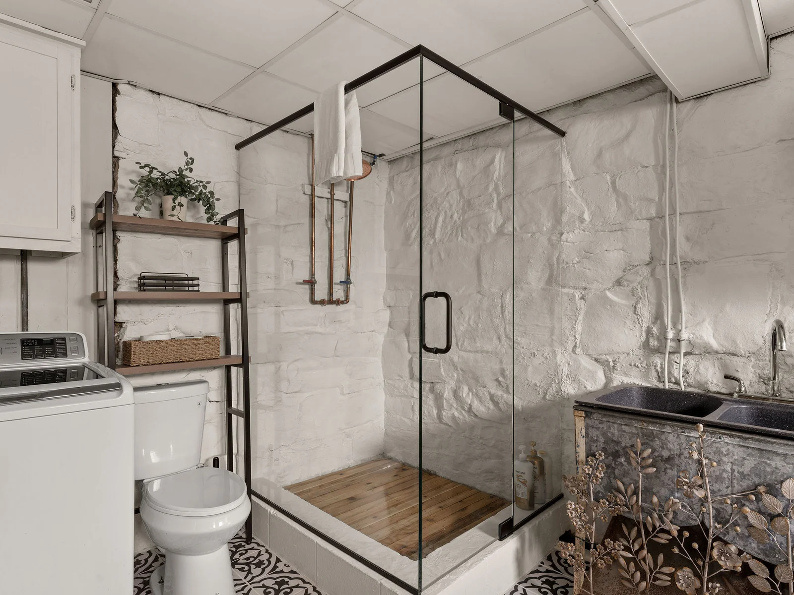 This gorgeous new glass-enclosed shower gave our lower-level bathroom a serious upgrade.