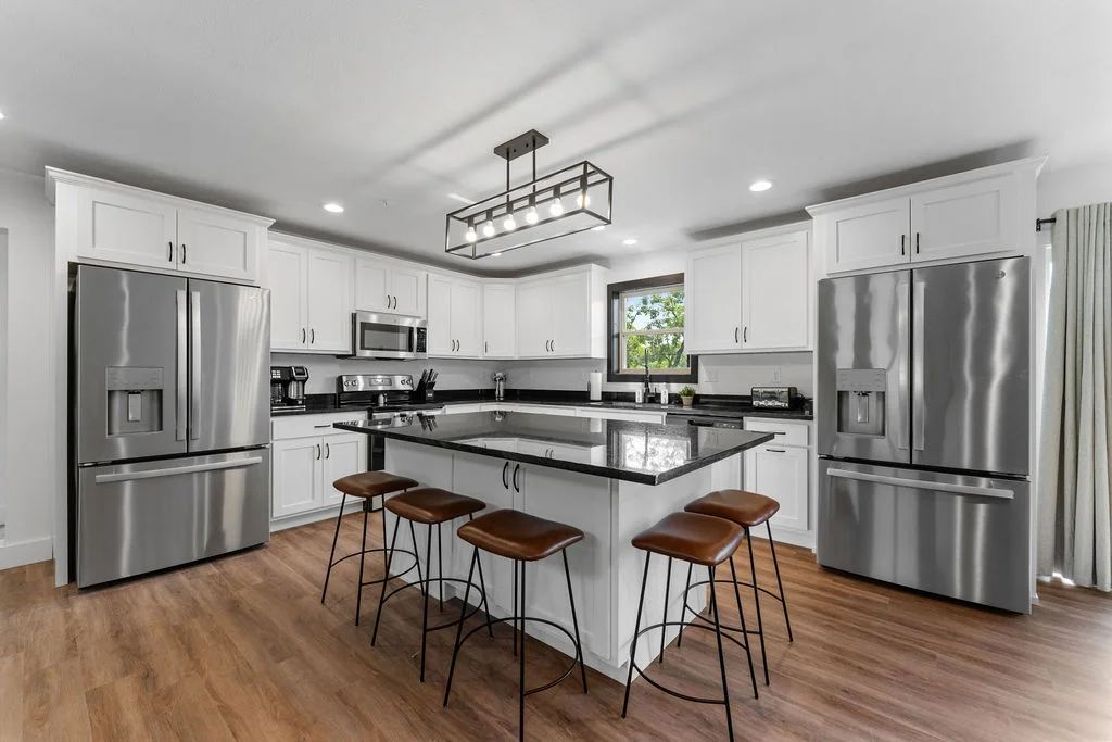 Well-appointed kitchen with stainless appliances and bar seating