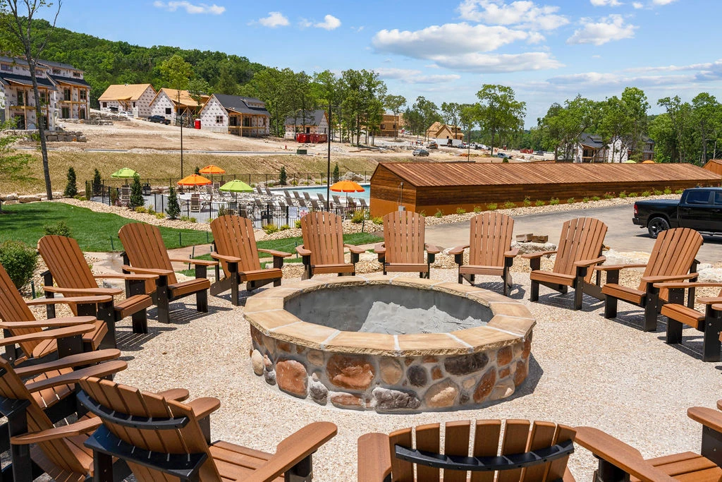 A community fire pit for gathering around the pool(s) and play areas