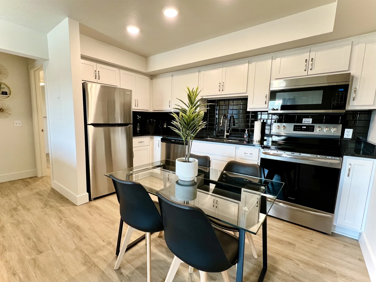Fully equipped kitchen and dining table seating four.
