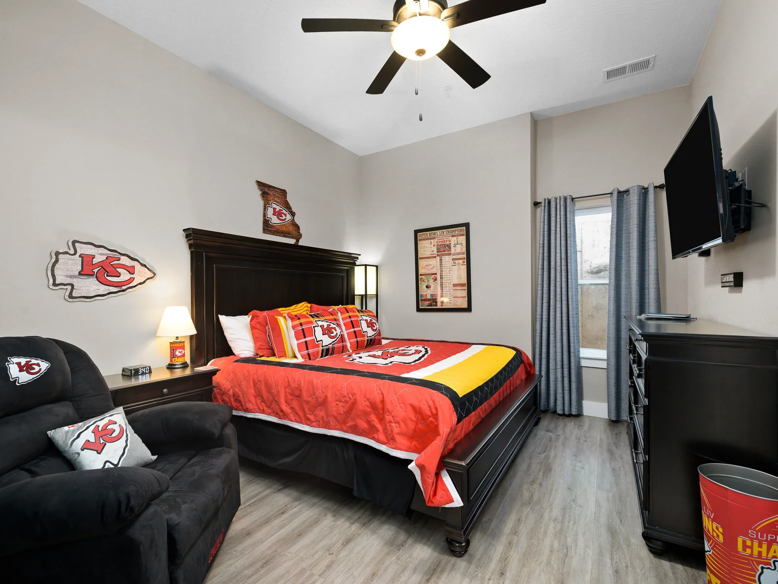 Lower level: Chiefs room with king bed, recliner, and en suite bathroom