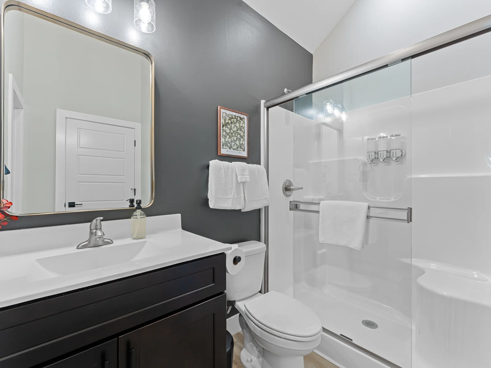 Luxurious Full Bathroom: Indulge in modern elegance with a sleek shower and chic decor!