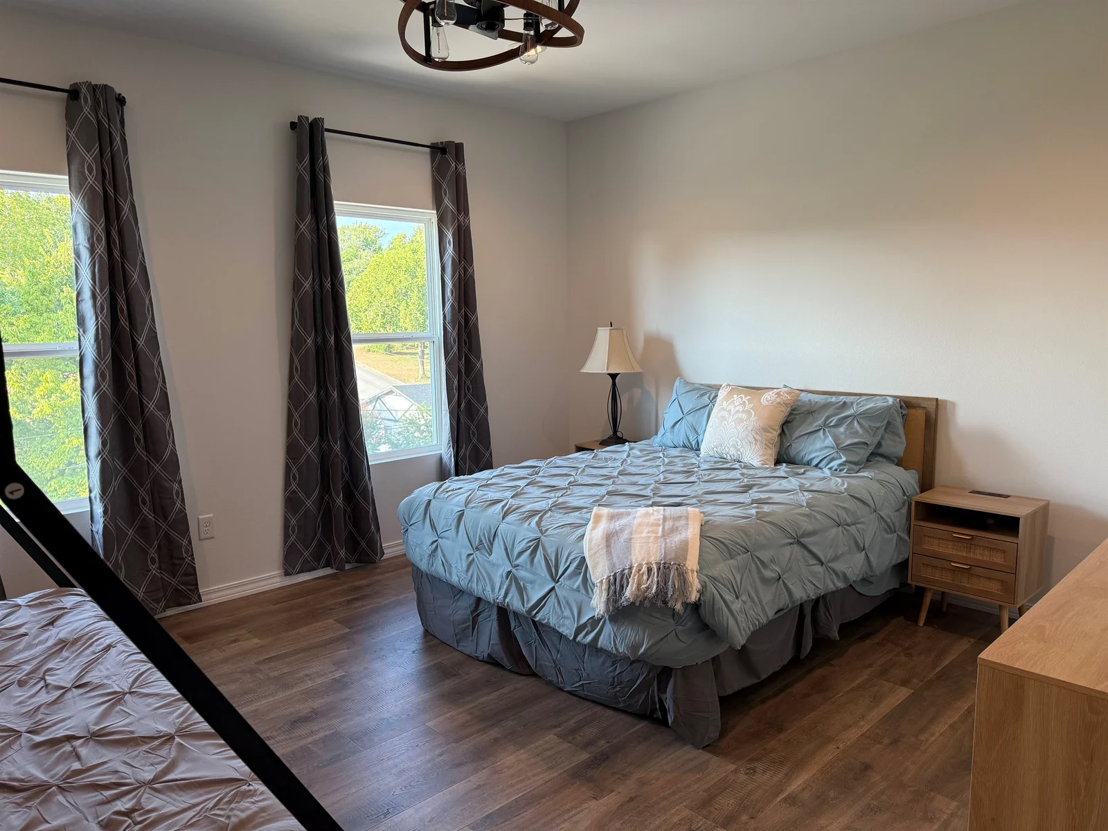 Bedroom #3 has a Queen bed and a set of Bunks. Lower bunk in a Queen and upper is a twin xl. Room is large enough to provide this amount of bedding and still have room to move around. Dresser and night stands also in room