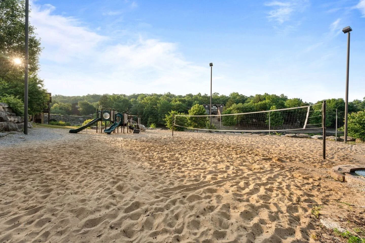 Sand volleyball and playground next to the main pool and playground. Walking distance from the cabin!