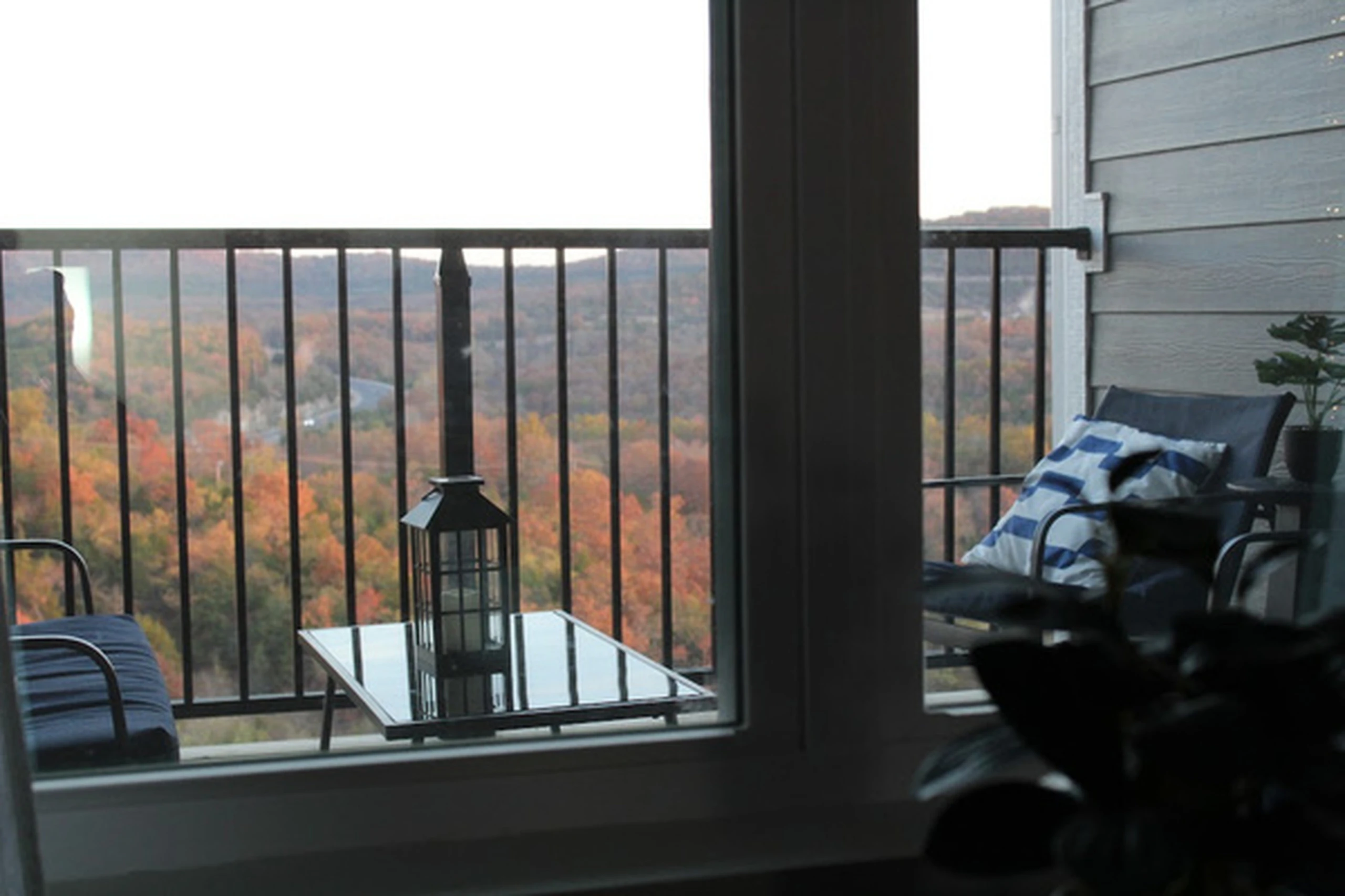 Enjoy quiet mornings or twilight on the balcony enjoying the fall foliage of the Ozark mountains just outside your living room.