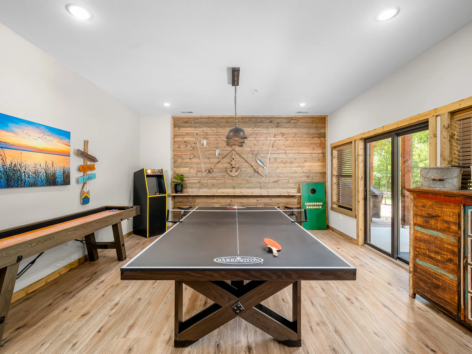 Ping pong, shuffleboard, arcade game, and cornhole.