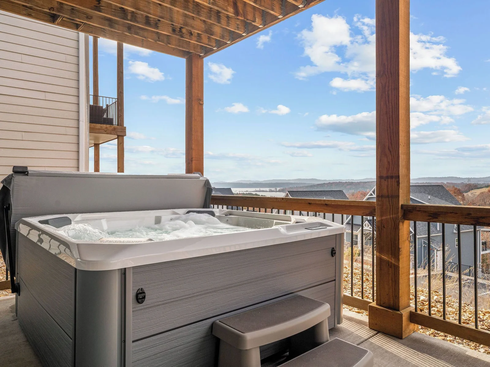 The brand new hot tub overlooks the lake