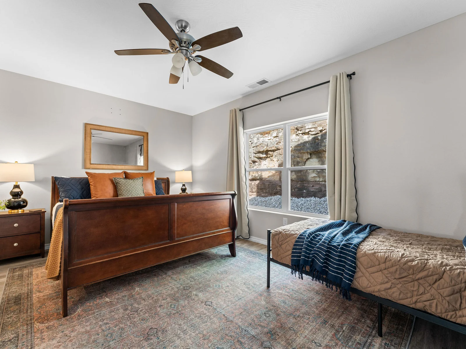 King bed with its own en-suite bath — the master gets the walk-in shower and the privacy. Everyone else has their own room too, but this one's the one people will want to claim first.