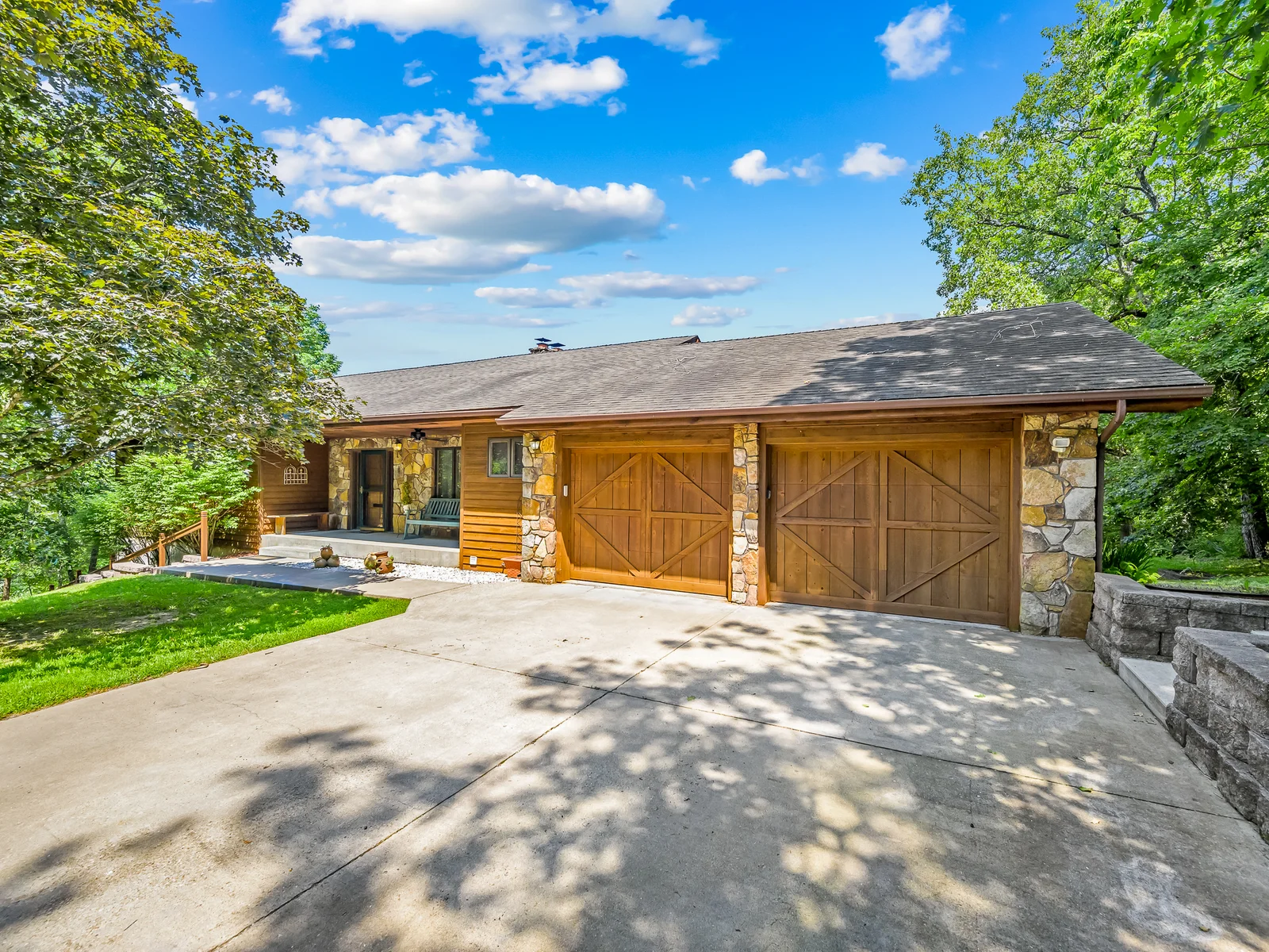 Two car garage and parking space for lots of vehicles. There are 2 additional parking pads as well as a very long driveway.