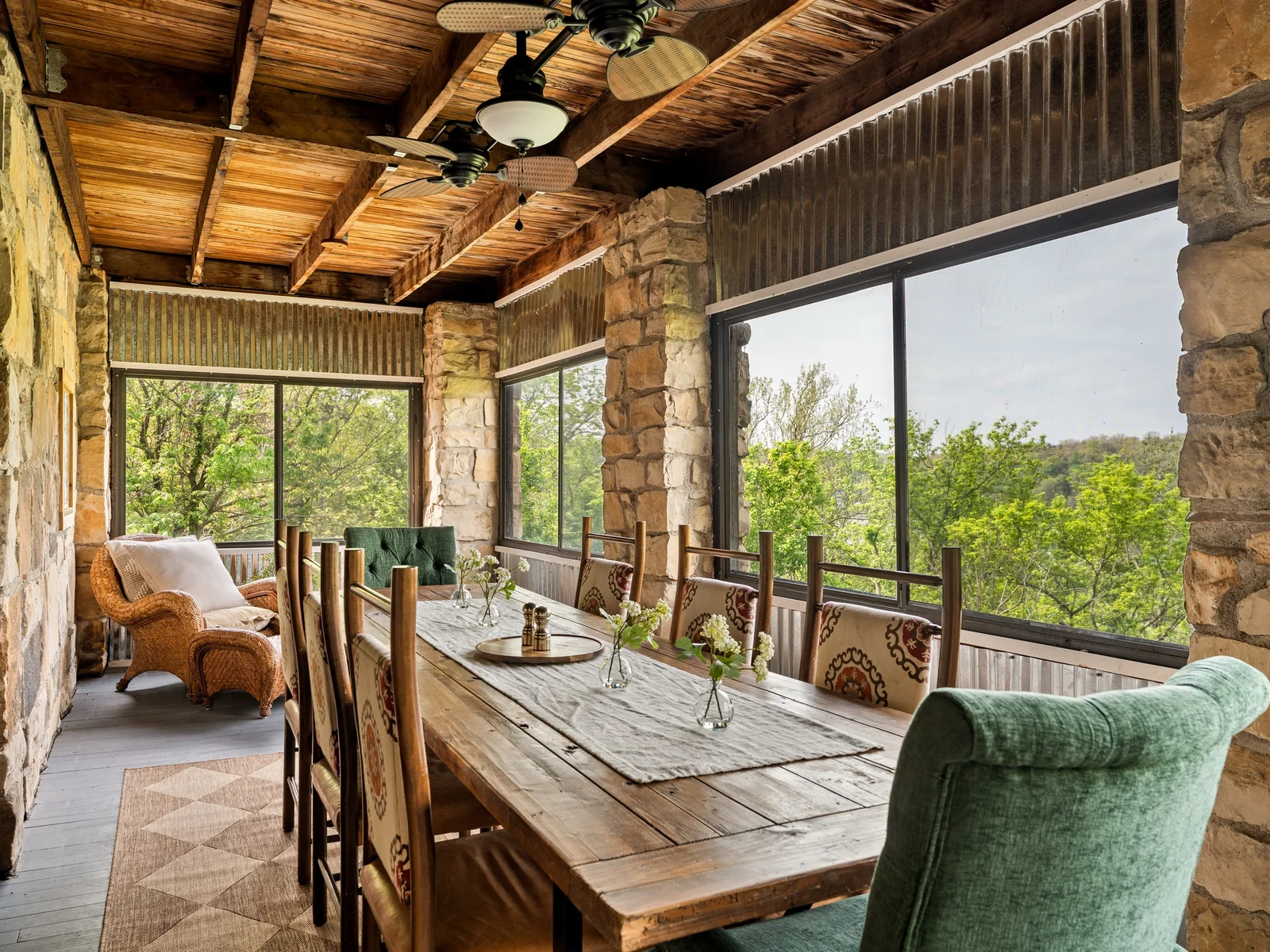 Dine surrounded by nature on the screened-in porch with seating for the whole group.