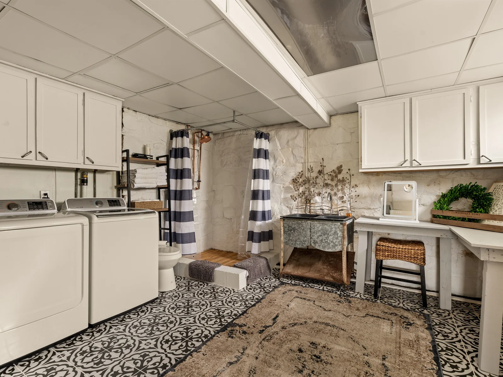 A unique lower-level retreat with full bath, in-home laundry, and a dedicated getting-ready space.