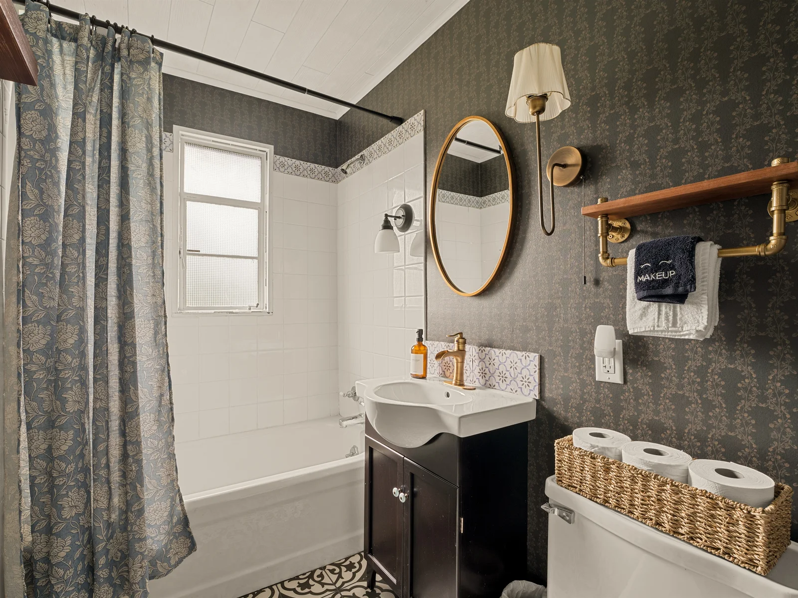 Classic charm with a cozy, elevated feel in the top level bathroom.