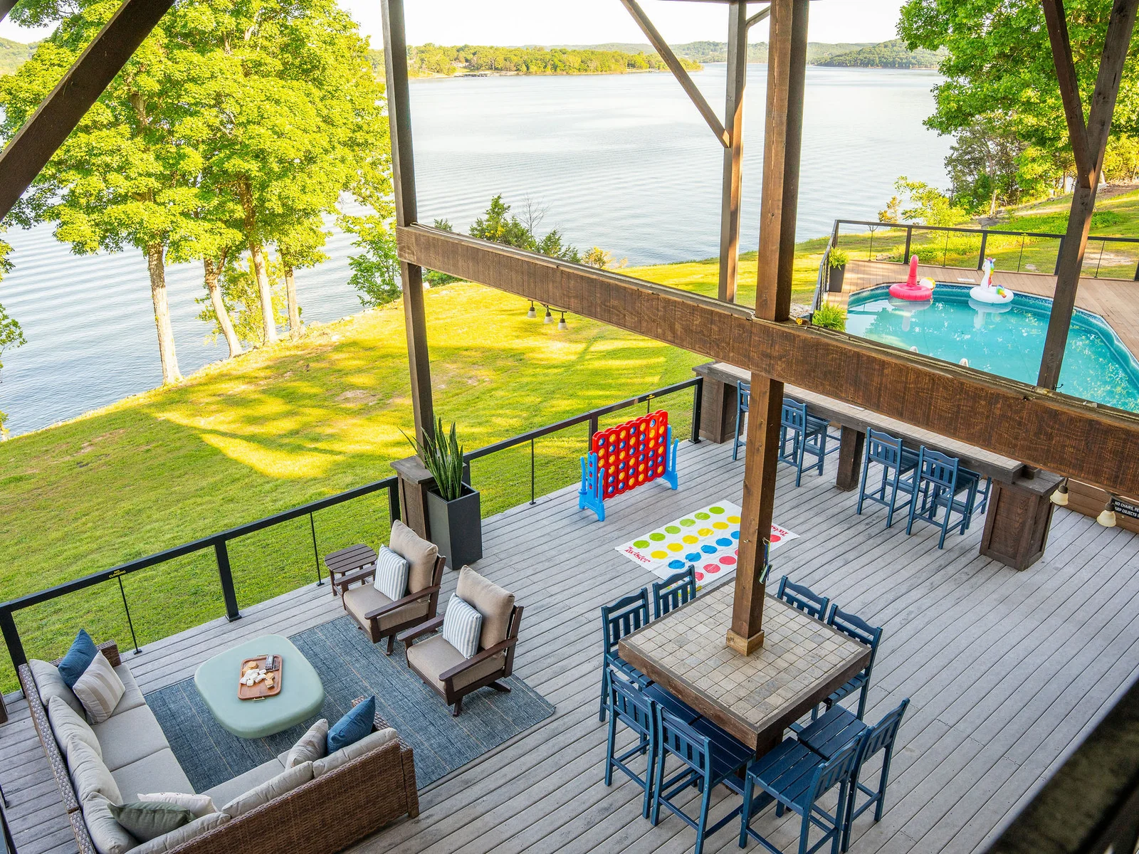 Enjoy elevated views of the pool, hot tub, and outdoor spaces from the deck, where every angle feels like a getaway.