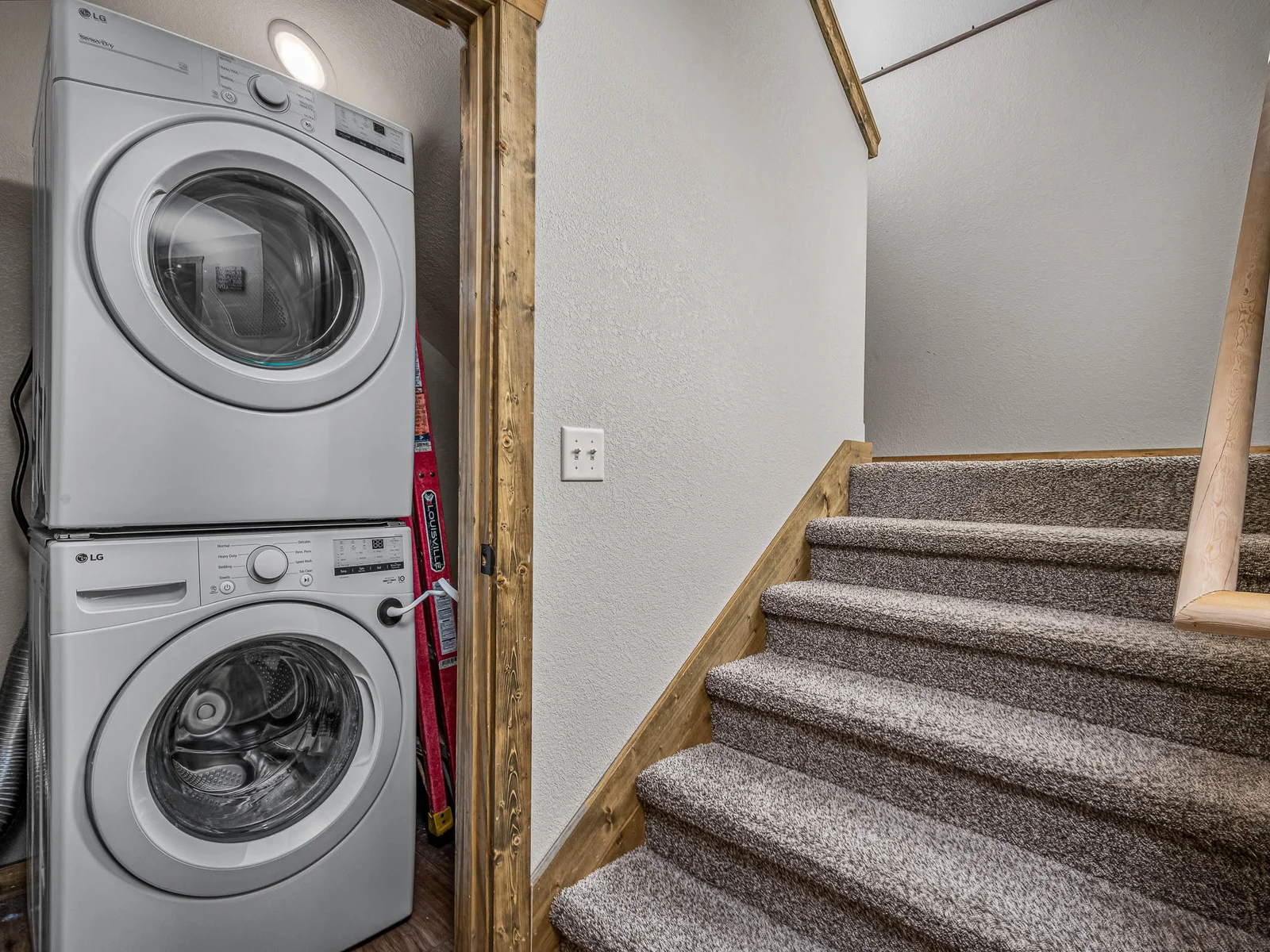 Stackable washer and dryer on the lower level