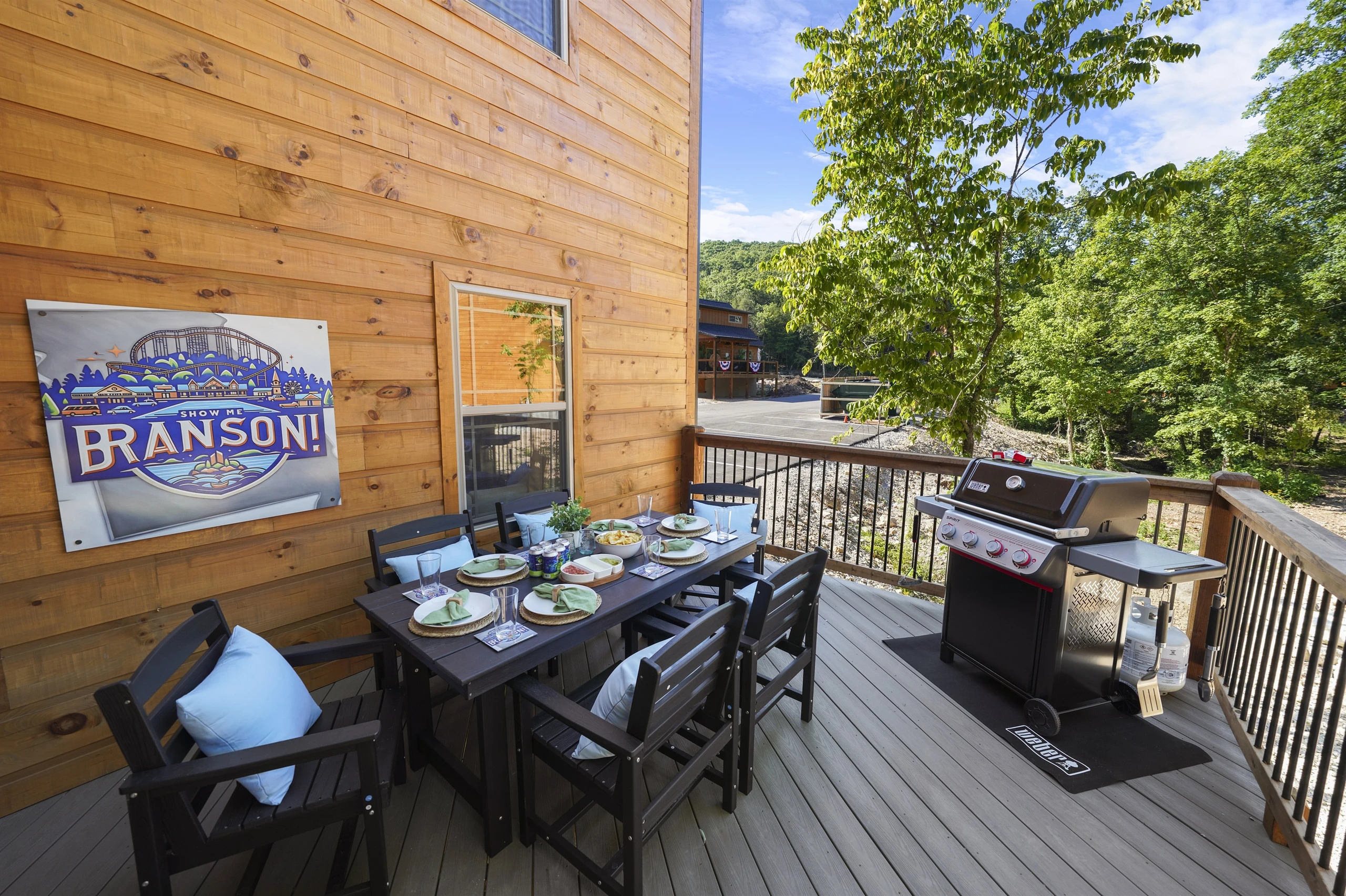 An outdoor area on the deck as well for having a meal and grilling up a storm