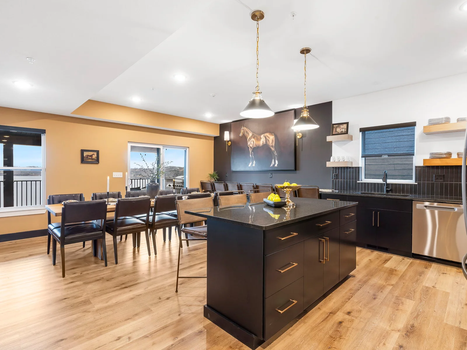 Dining table, bar seating, and extra bar seating along the wall