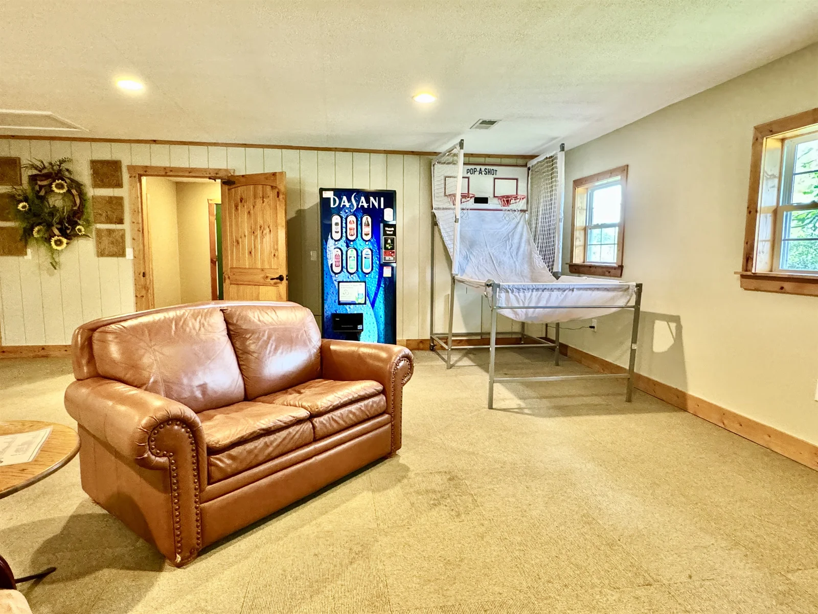 Community Clubhouse with a basketball game and Tv seating area