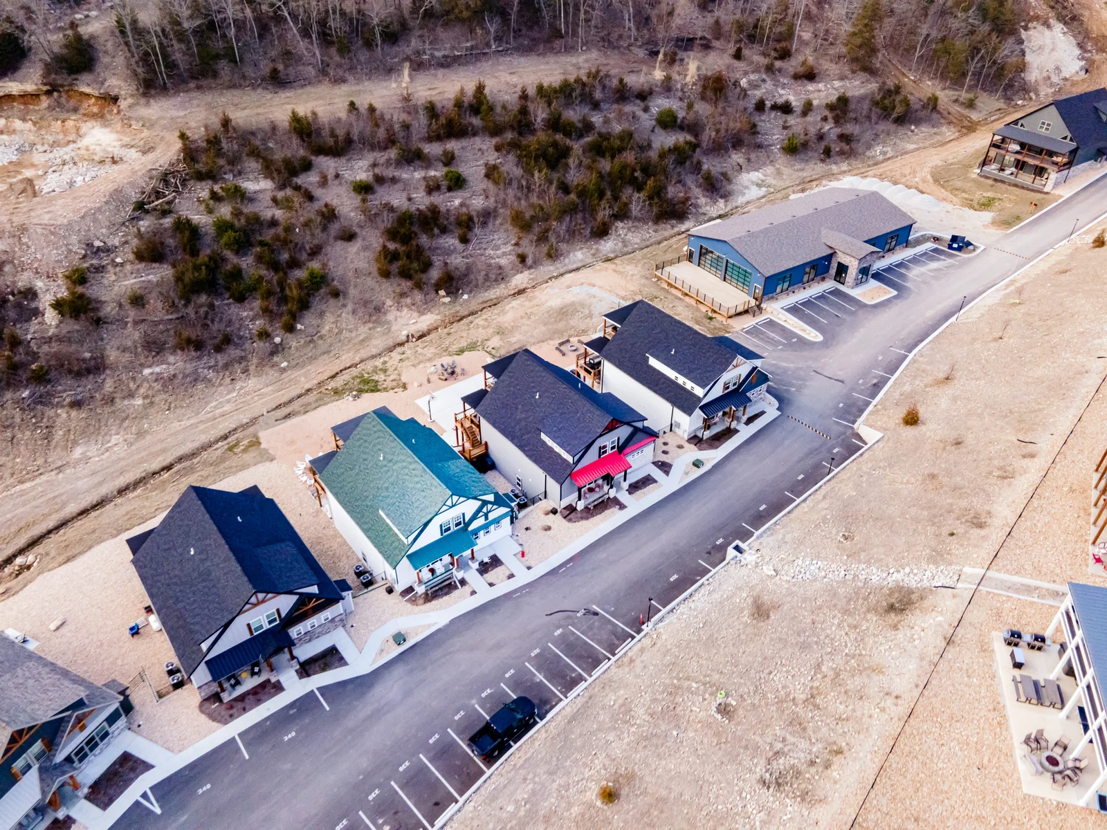 Indoor pool located on the right of this picture. We have 3 neighboring properties available! Game Day is the home with the red metal porch roof.