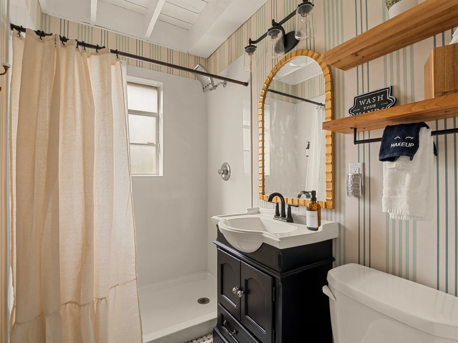 Full bathroom with walk-in shower.