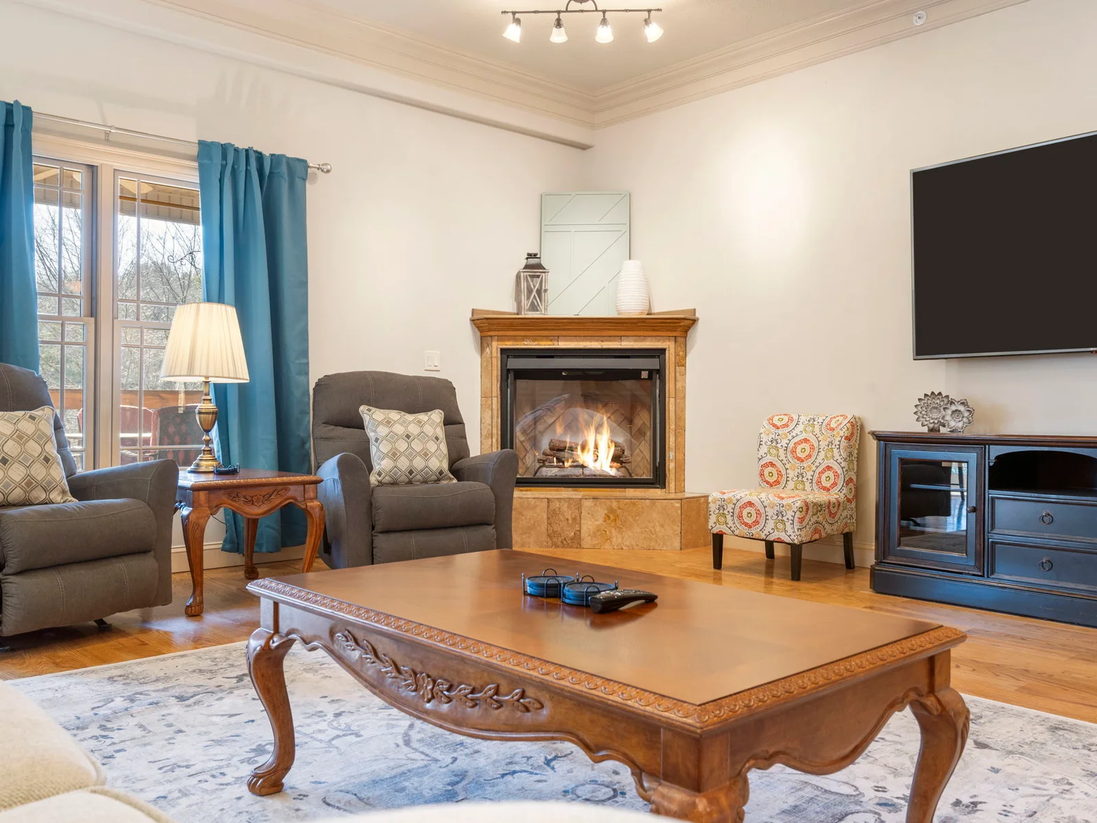 Spacious main level living area with electric fireplace