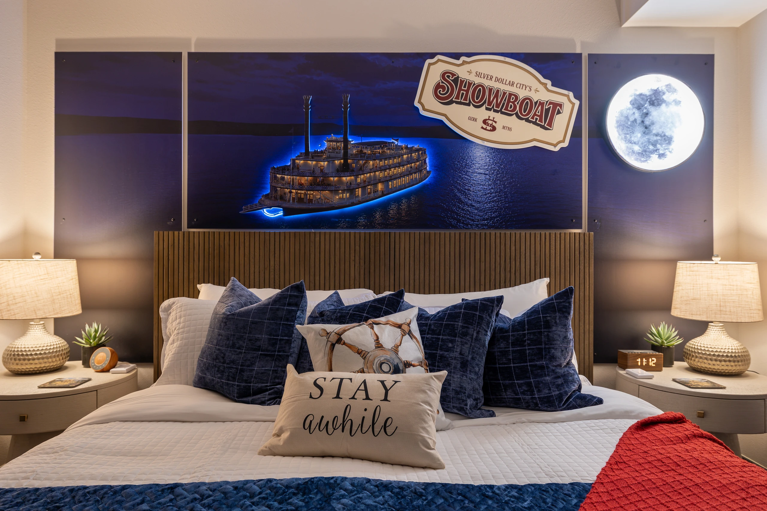 Warm lamplight and a paddle-wheeler drifting across the mural.
