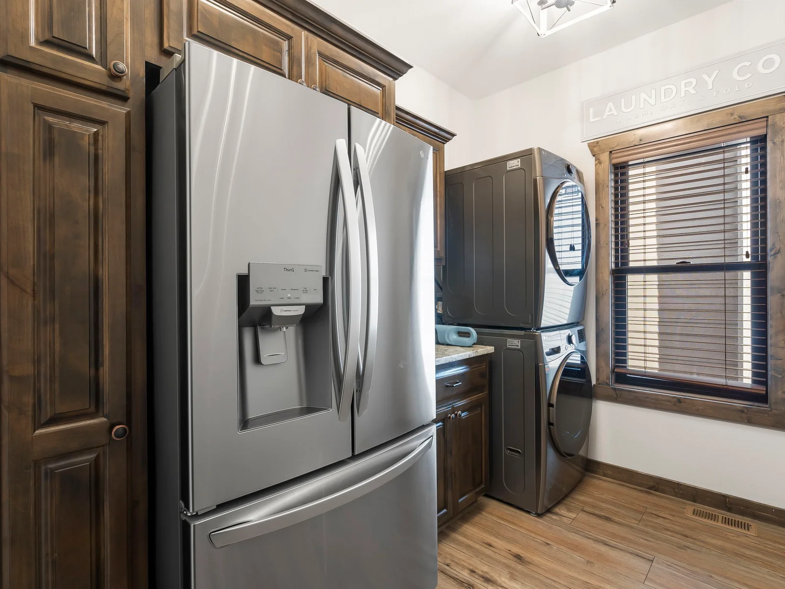 Main floor laundry and additional full sized fridge just off of the kitchen