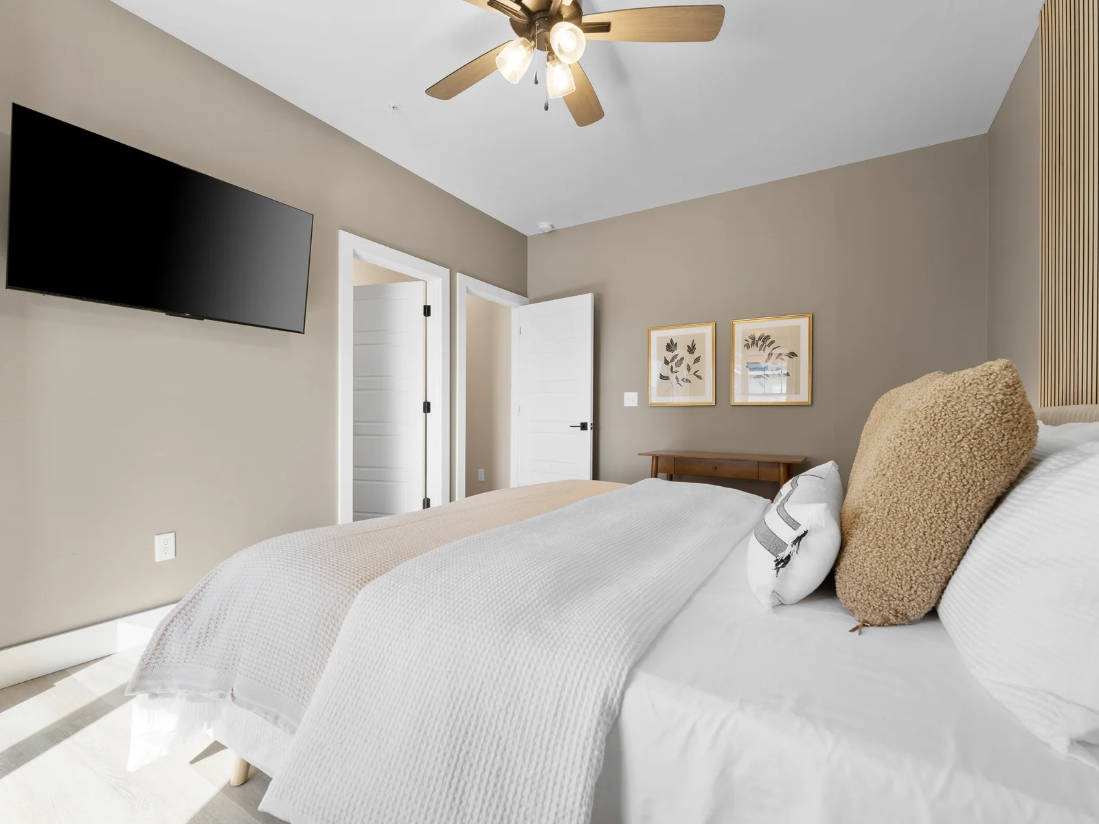 Bedroom Retreat: Enjoy movie nights on the wall-mounted TV and unwind in this stylish haven!