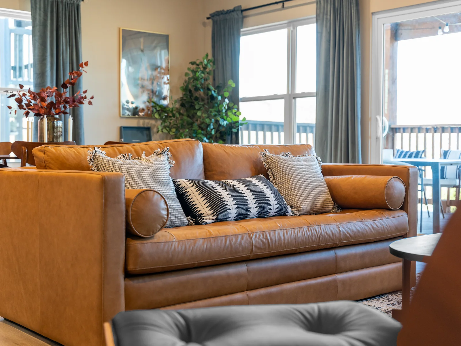 Living Room: Relax in style on this chic leather sofa with scenic views and modern decor!
