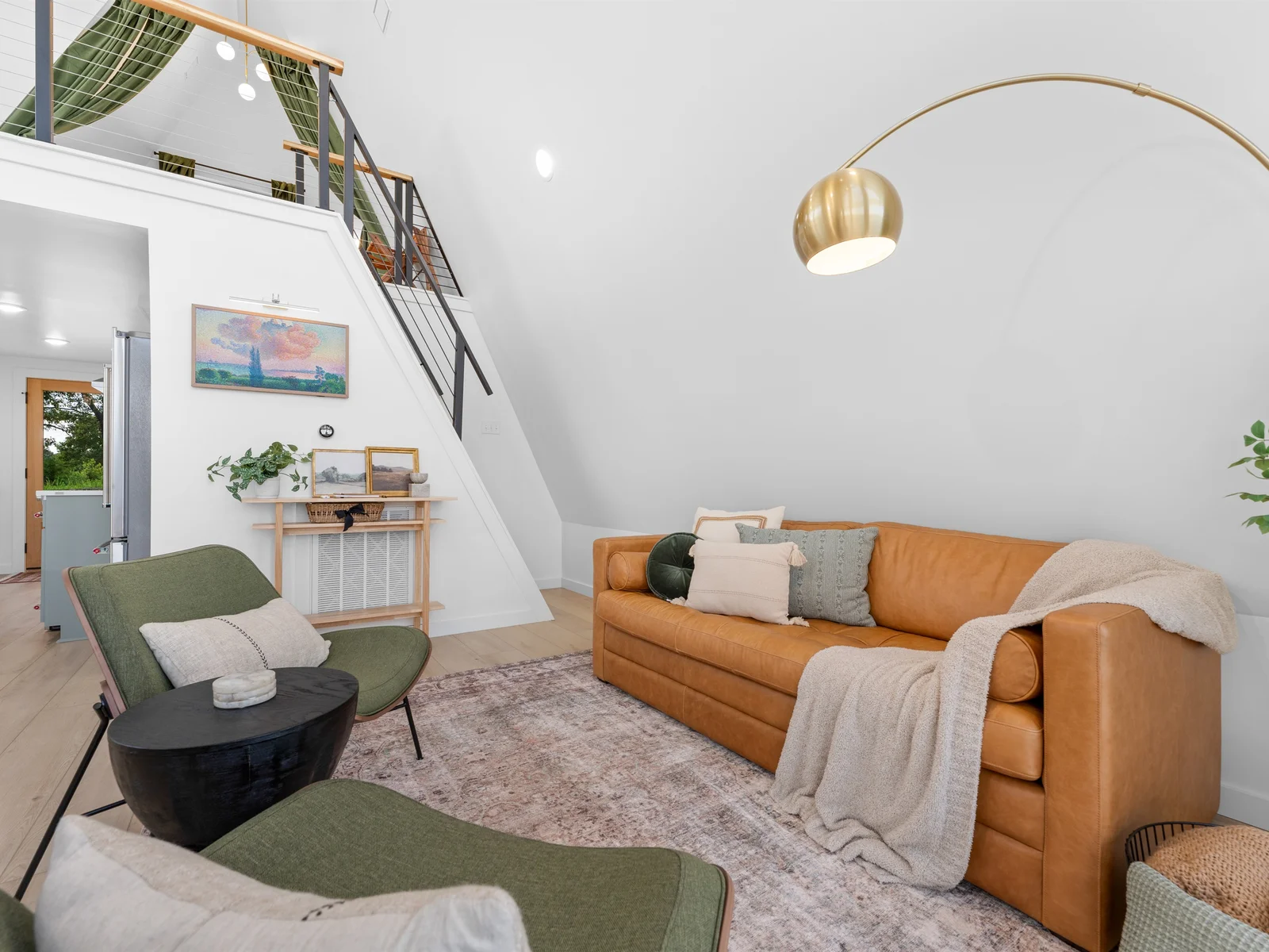 Living Room: Stylish space with warm textures, artistic decor, and a touch of modern charm!