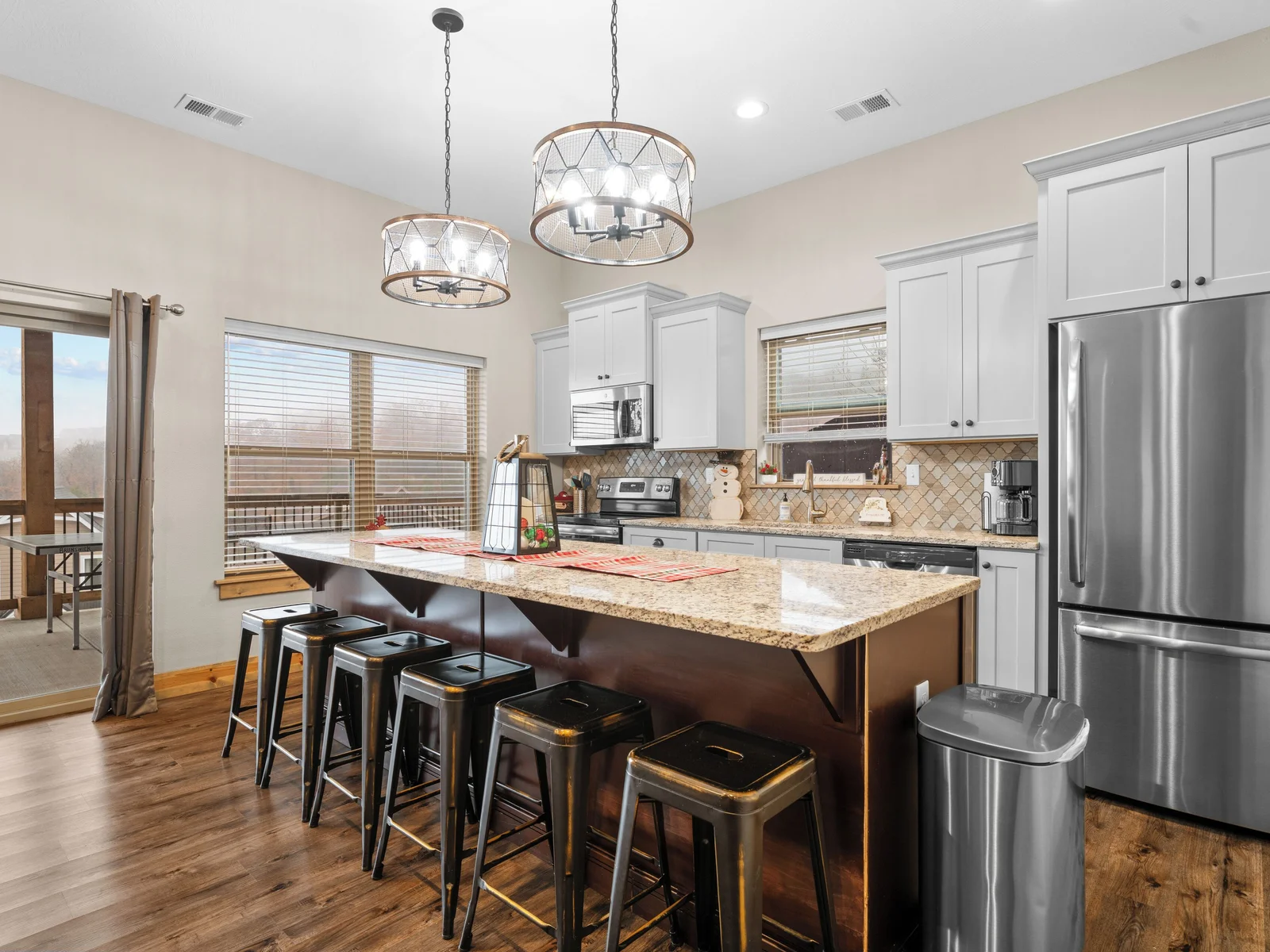 Lower level FULL kitchen. Refrigerator, dishwasher, oven/ceramic glass cooktop, microwave, drip coffee maker, Keurig, and Nespresso. Stocked with small appliances, cookware, bakeware, utensils, dishes, glassware, mugs, and more!