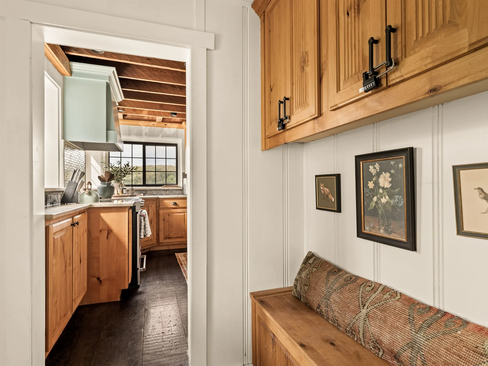 Charming nook with built-in bench seating—perfect for a quiet moment or slipping on your shoes.
